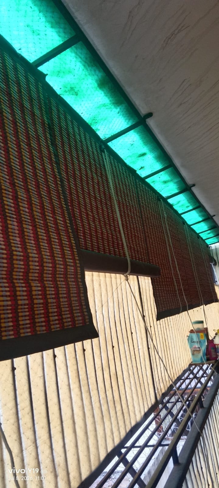 Corrugated fibre roofing sheet installed for terrace weather protection in Greater Noida