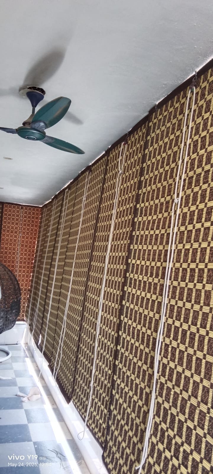 Master artisan weaving raw bamboo strips for chick blinds in Greater Noida workshop