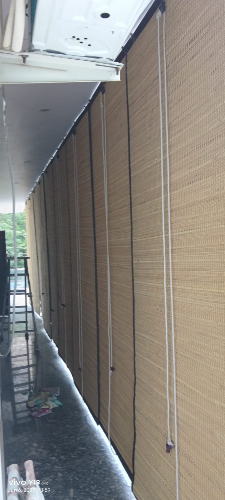 Long corridor bamboo chicks providing shade and privacy along entire passage